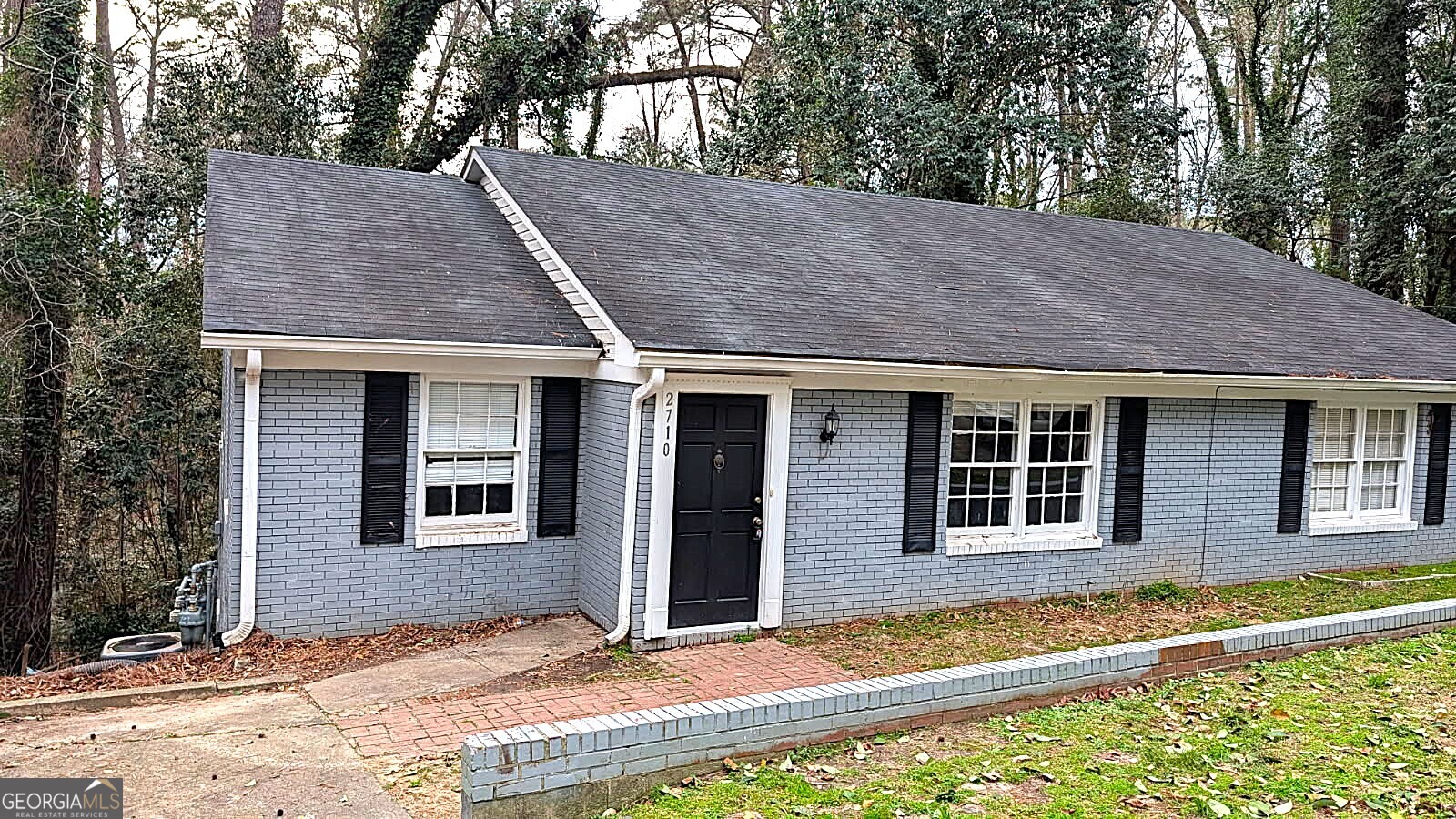 2710 Riverview Road Macon, GA 31204 - Photo 1 of 1 a view of a house with a yard and wooden fence
