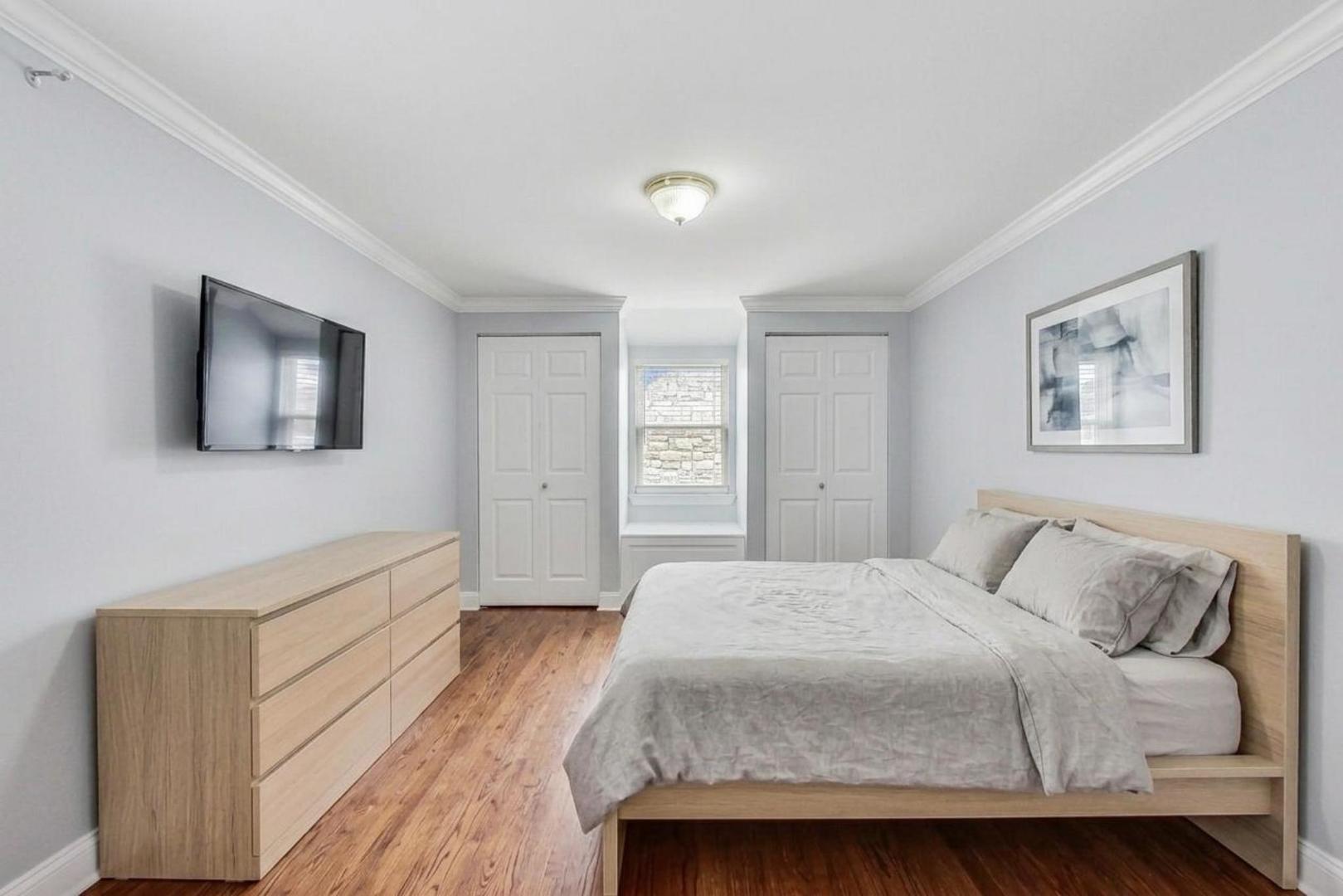 402 North Main Street Mount Prospect, IL 60056 - Photo 11 of 19 a bedroom with a bed and a flat screen tv