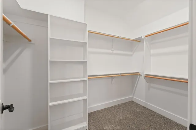a view of an empty walk in closet
