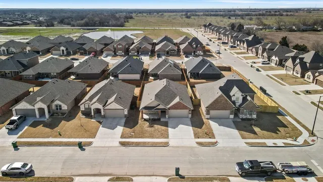 an aerial view of a houses with outdoor space