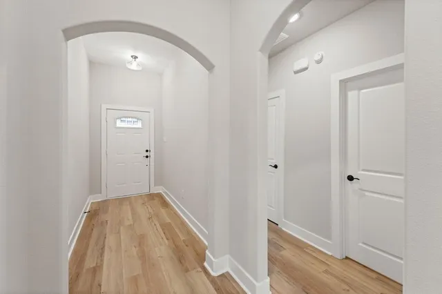 a view of a room with wooden floor and staircase