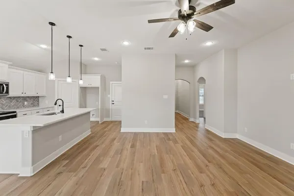 a large kitchen with a hard wood floor