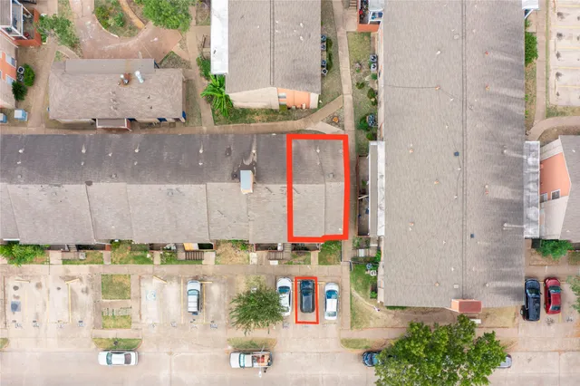 an aerial view of residential houses and outdoor space