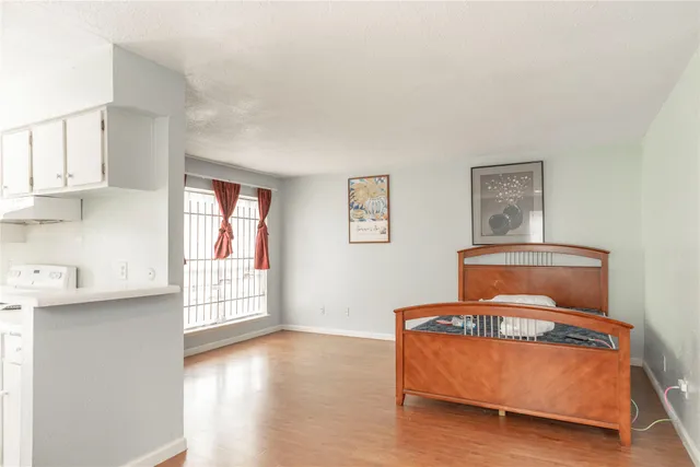 a room with a bed and window