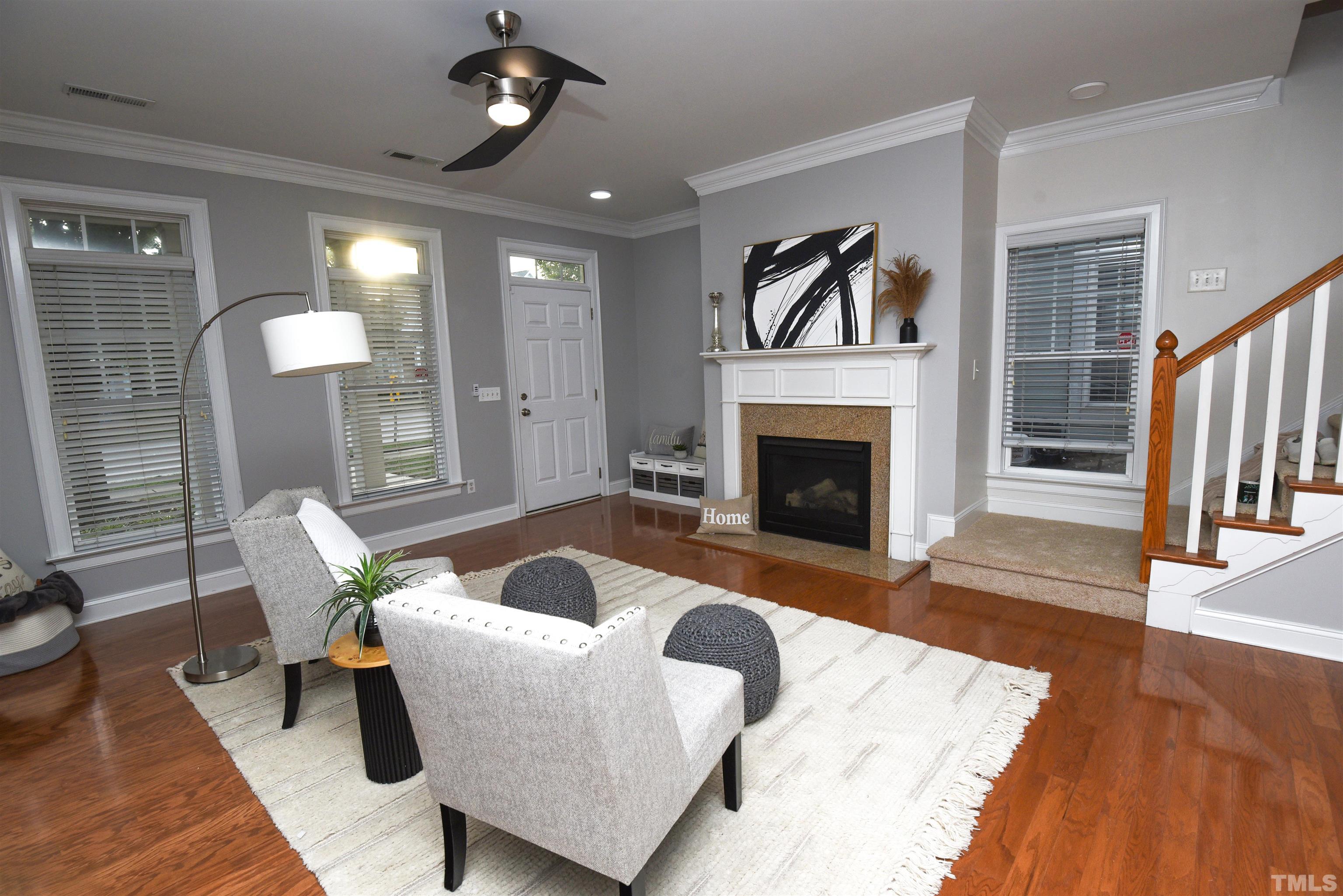 7738 ACC Boulevard Raleigh, NC 27617 - Photo 1 of 17 a living room with furniture and a fireplace