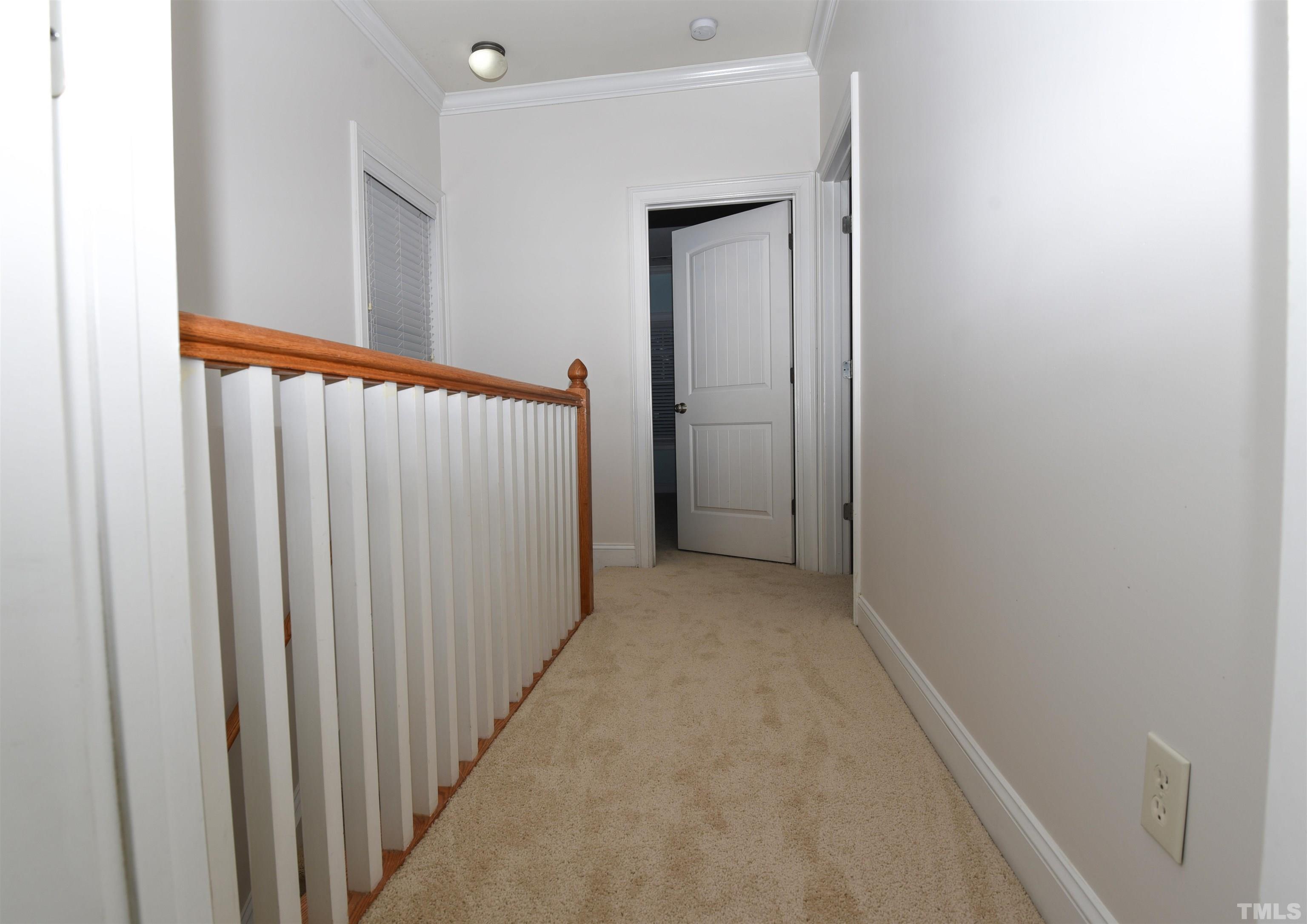 7738 ACC Boulevard Raleigh, NC 27617 - Photo 12 of 17 a view of a hallway with a window