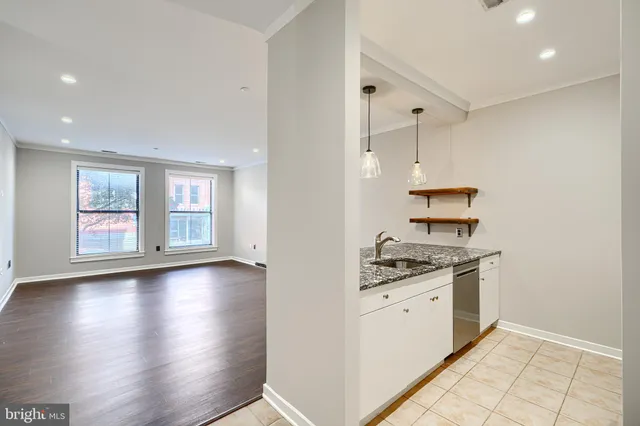 a kitchen with stainless steel appliances granite countertop a stove and a refrigerator