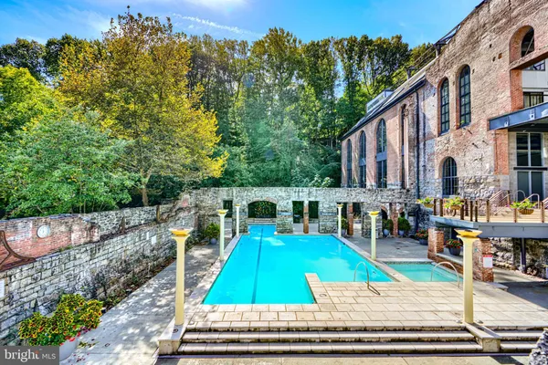 a view of a swimming pool with a patio