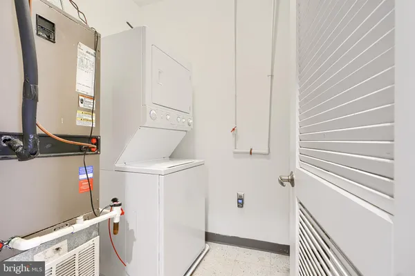 a view of a room with wooden floor and windows