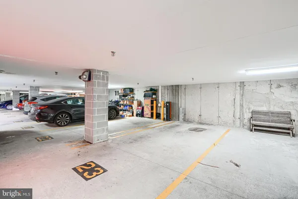 a view of parking garage with a table and chairs
