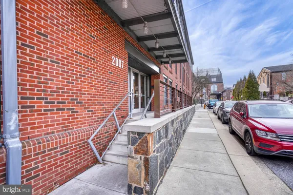 a view of a patio with dining table and chairs