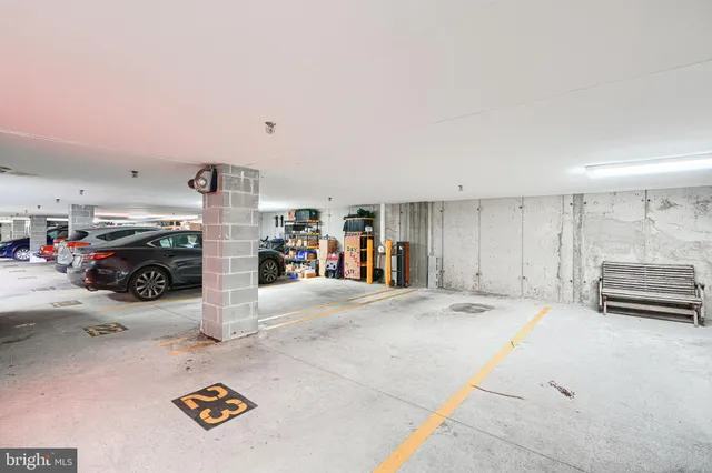 a view of parking garage with a table and chairs