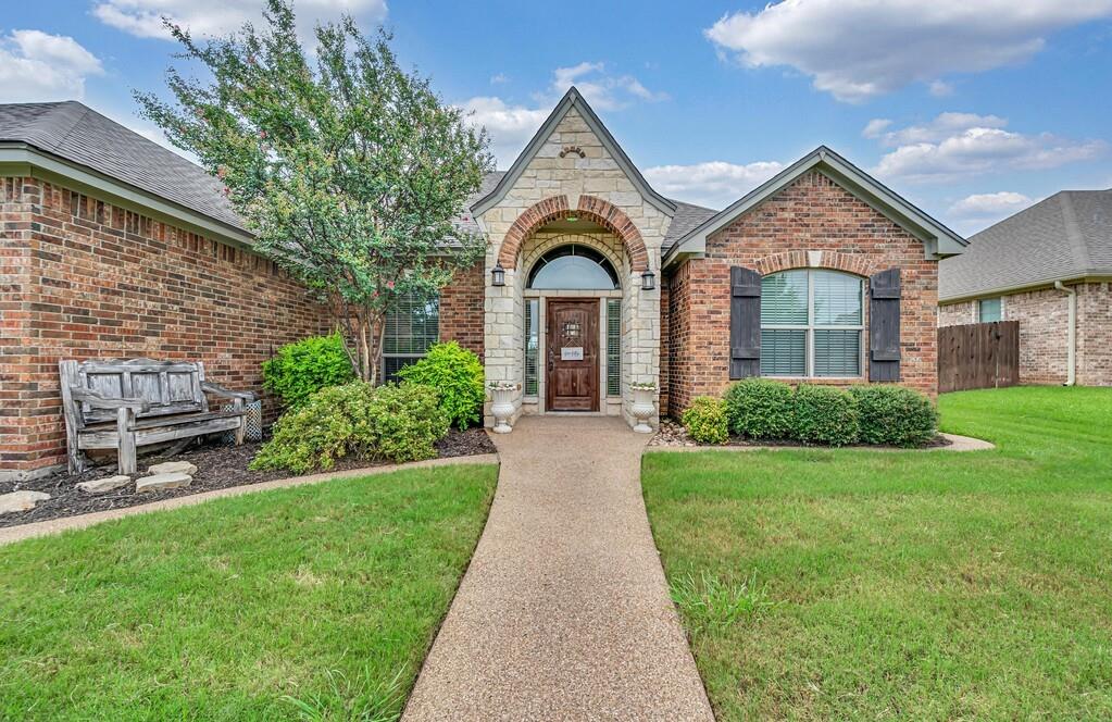 550 Hunton Lane Robinson, TX 76706 - Photo 2 of 35 View of front facade featuring brick siding and stone siding