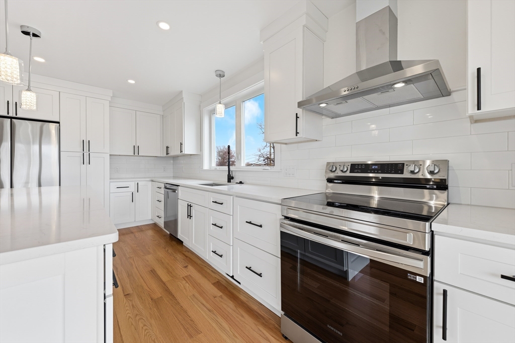 2 Old County Road, Unit 12 Salisbury, MA 01952 - Photo 4 of 29 a kitchen with stainless steel appliances white cabinets and a sink