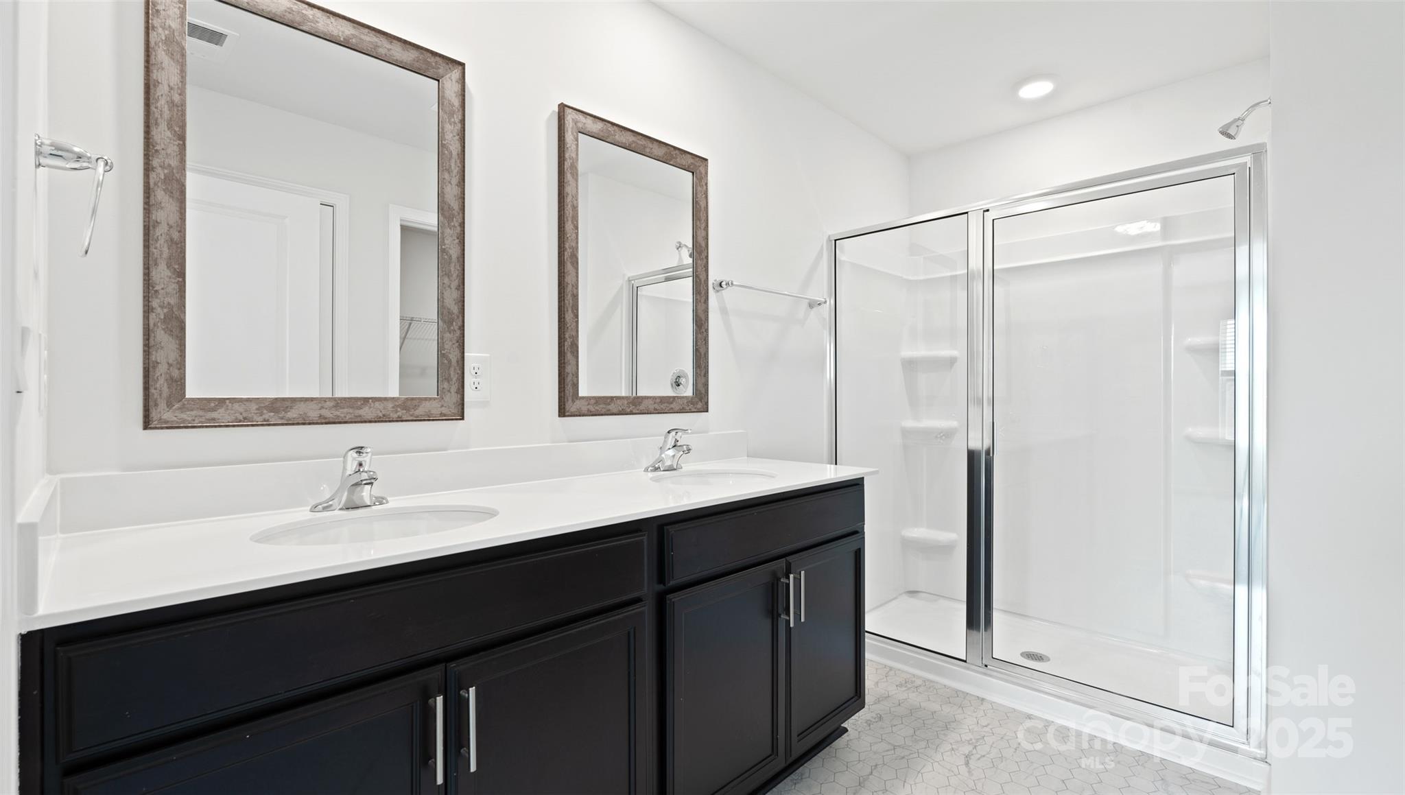205 Callie River Clyde, NC 28721 - Photo 14 of 20 a bathroom with double sink and a mirror