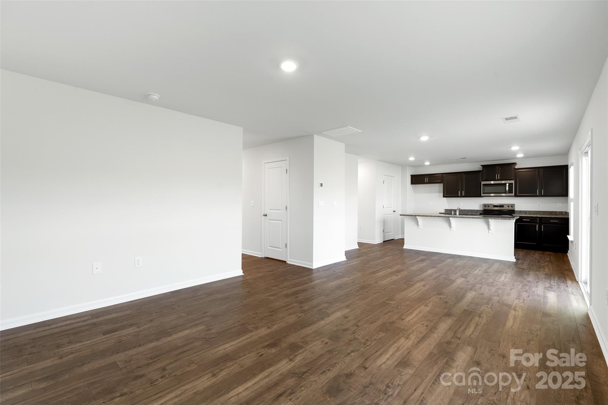 205 Callie River Clyde, NC 28721 - Photo 7 of 20 a view of kitchen with wooden floor