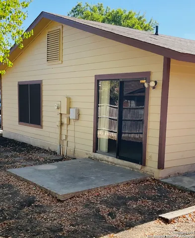 a view of a backyard of the house