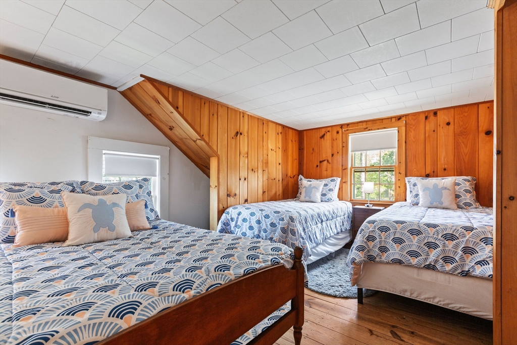 64 Beaten Road Dennis, MA 02639 - Photo 18 of 18 a bedroom with two beds and a large window