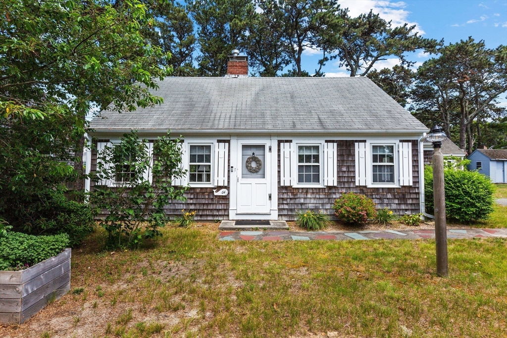 64 Beaten Road Dennis, MA 02639 - Photo 3 of 18 front view of house with a yard