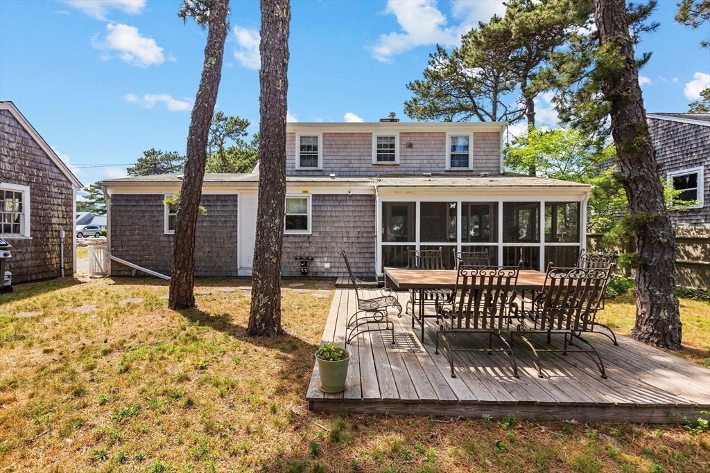 64 Beaten Road Dennis, MA 02639 - Photo 4 of 18 a view of a house with backyard and porch