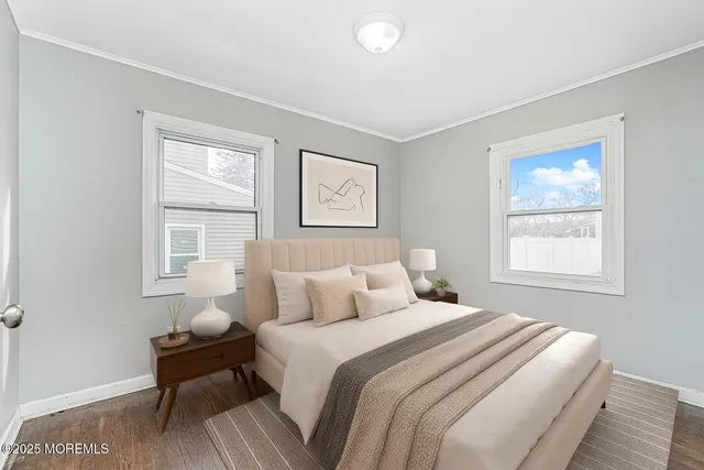 a bedroom with bed and a window