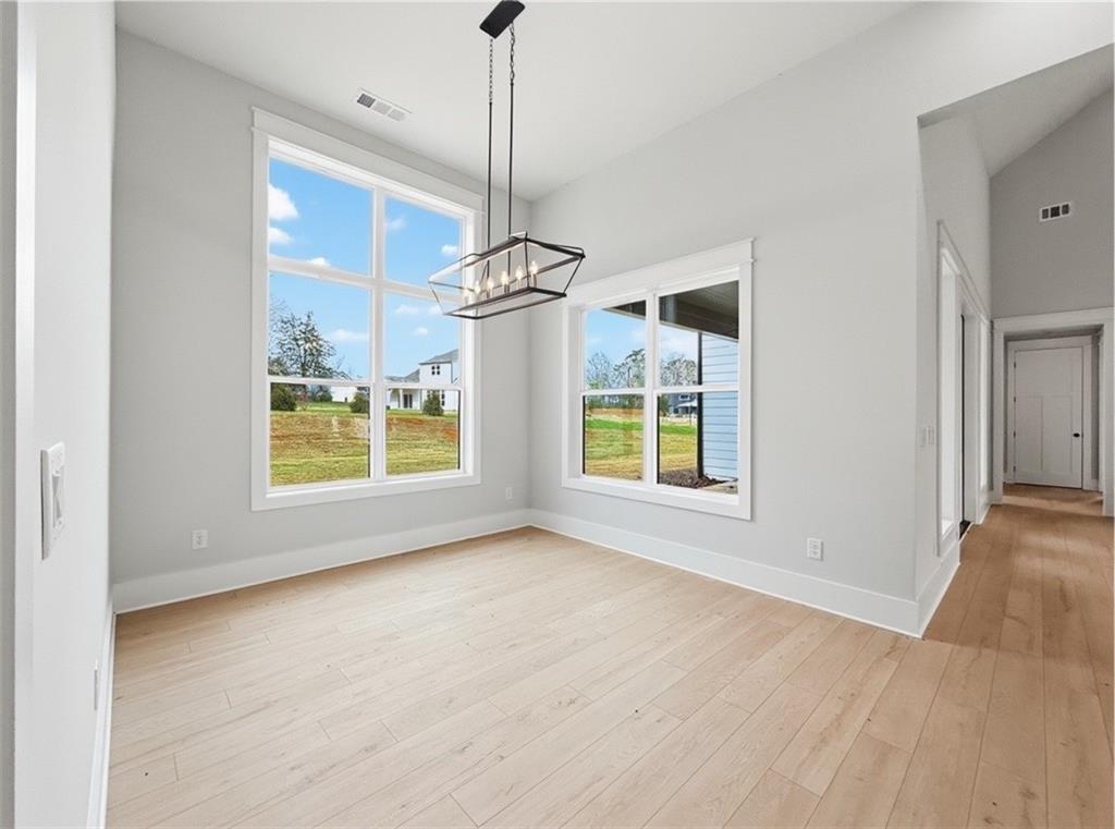 115 Palisade Drive Rydal, GA 30171 - Photo 29 of 74 a view of an empty room with a window and wooden floor