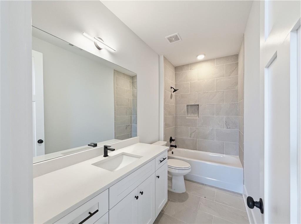 115 Palisade Drive Rydal, GA 30171 - Photo 56 of 74 a bathroom with a double vanity sink toilet and shower