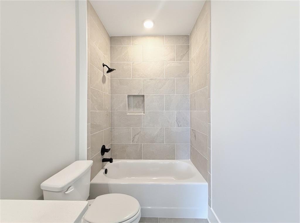 115 Palisade Drive Rydal, GA 30171 - Photo 58 of 74 a bathroom with a toilet bathtub and shower