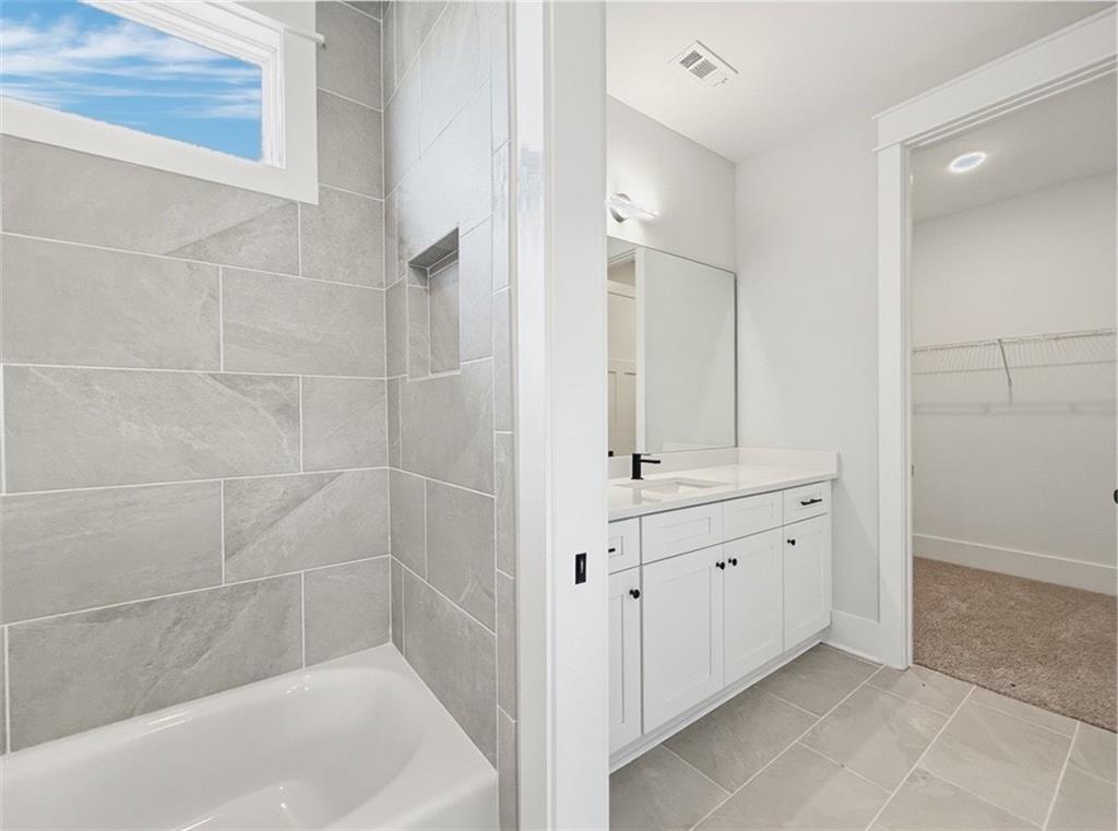 115 Palisade Drive Rydal, GA 30171 - Photo 64 of 74 a bathroom with a bathtub and a sink