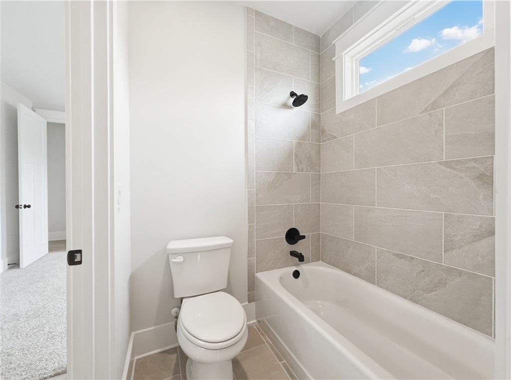 115 Palisade Drive Rydal, GA 30171 - Photo 65 of 74 a bathroom with a toilet and a bath tub