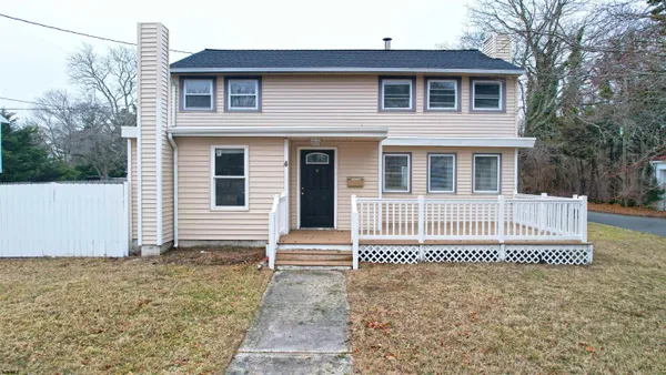 a front view of a house with a fence