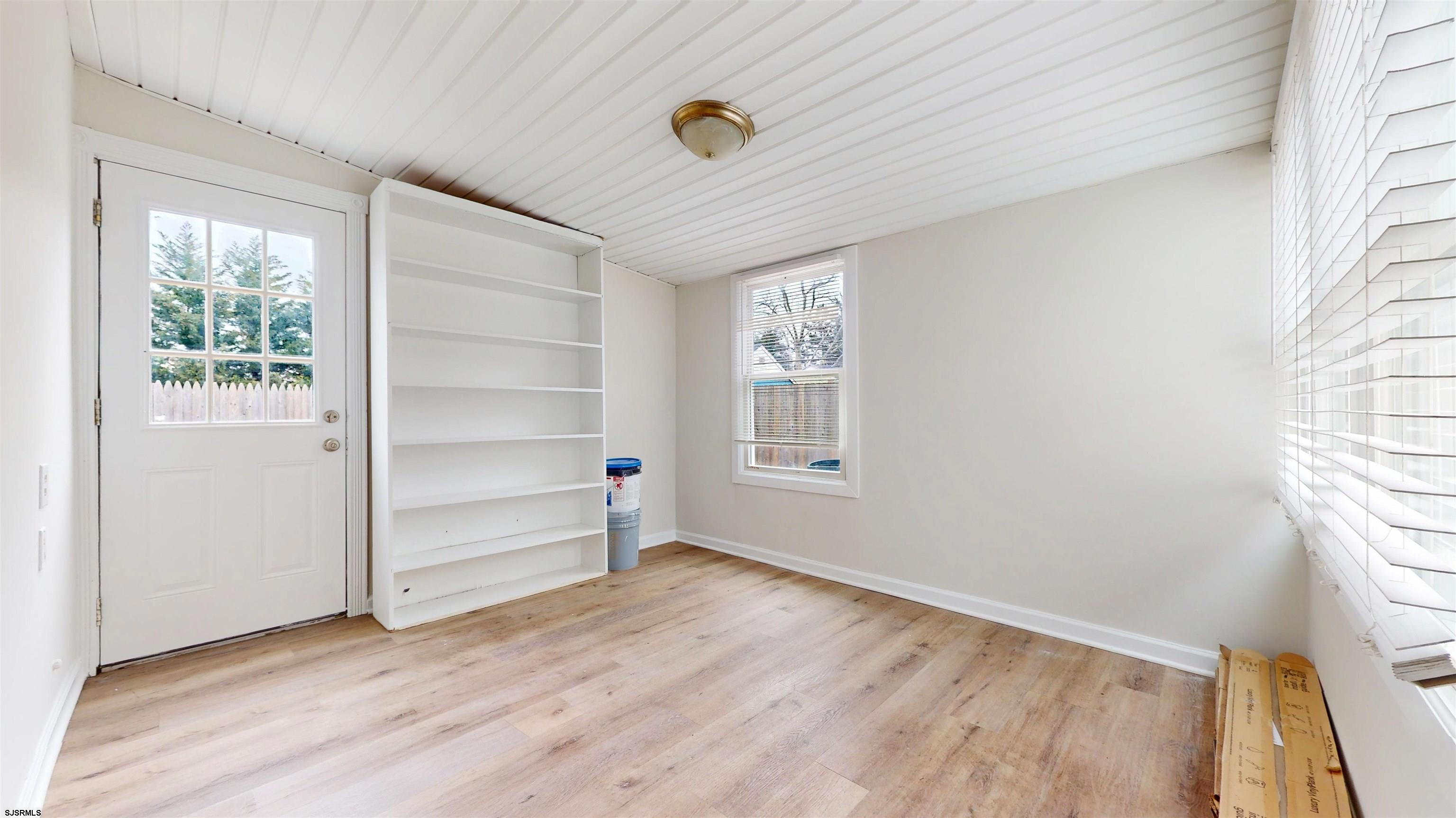 4 East Mill Road Northfield, NJ 08225 - Photo 22 of 49 an empty room with wooden floor closet and windows