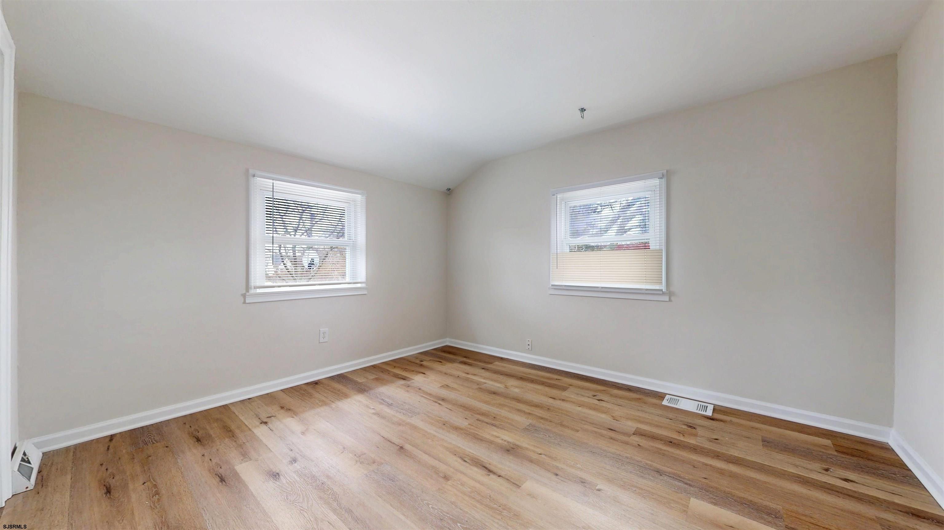 4 East Mill Road Northfield, NJ 08225 - Photo 27 of 49 a view of room with window and wooden floor