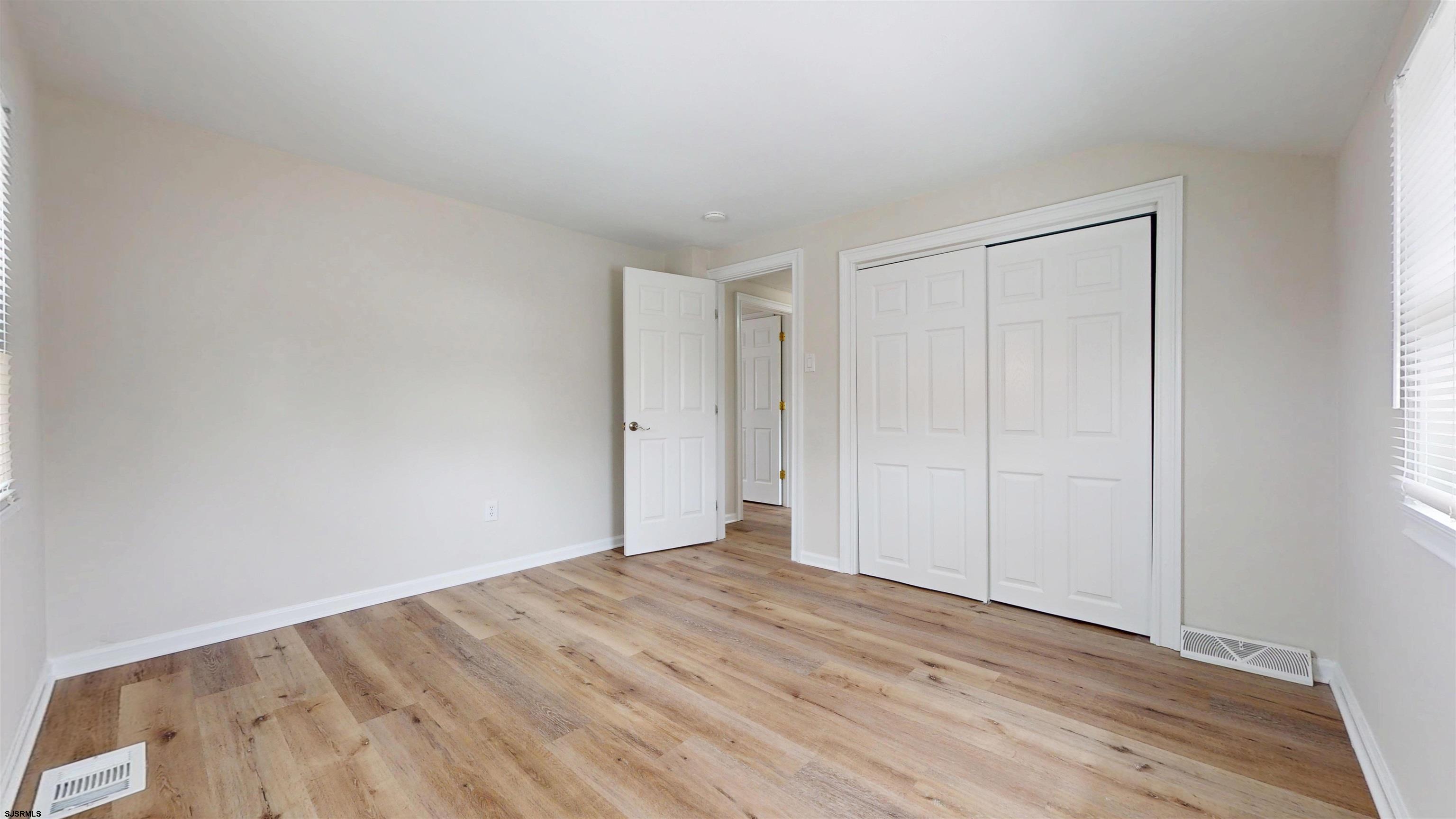 4 East Mill Road Northfield, NJ 08225 - Photo 28 of 49 a view of an empty room and wooden floor
