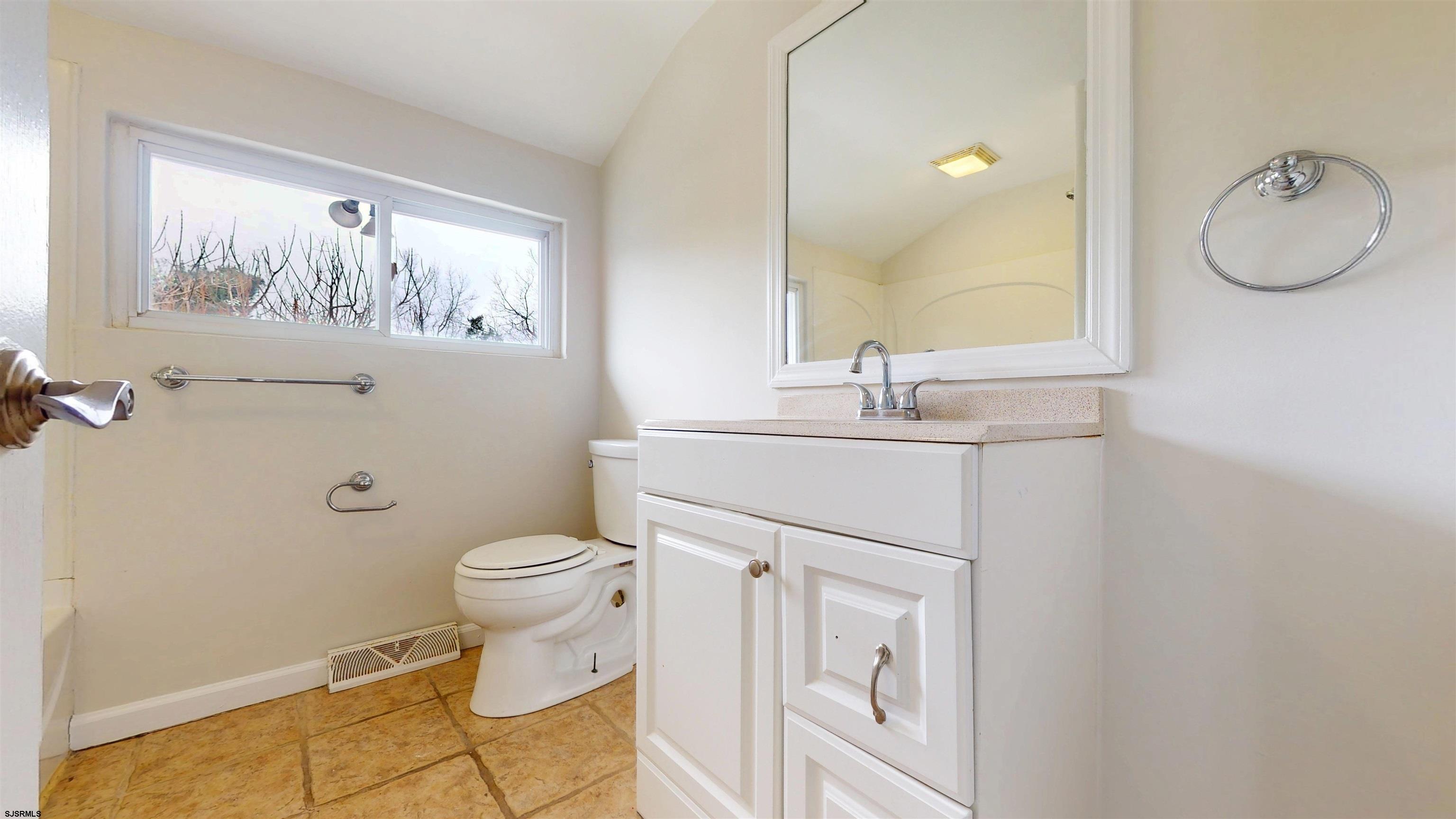 4 East Mill Road Northfield, NJ 08225 - Photo 29 of 49 a bathroom with a granite countertop toilet sink and mirror