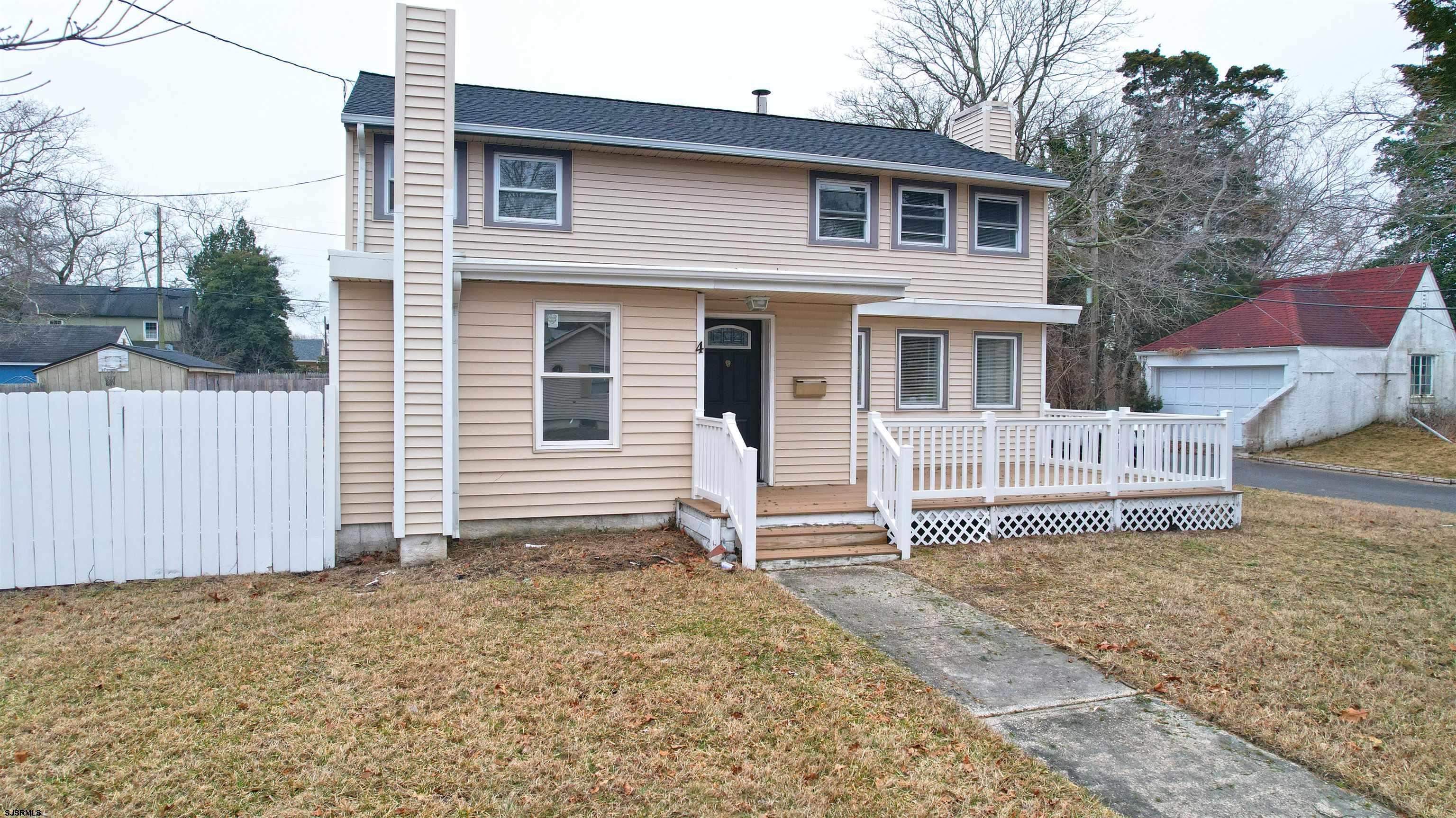 4 East Mill Road Northfield, NJ 08225 - Photo 3 of 49 a house that has a window in front of it