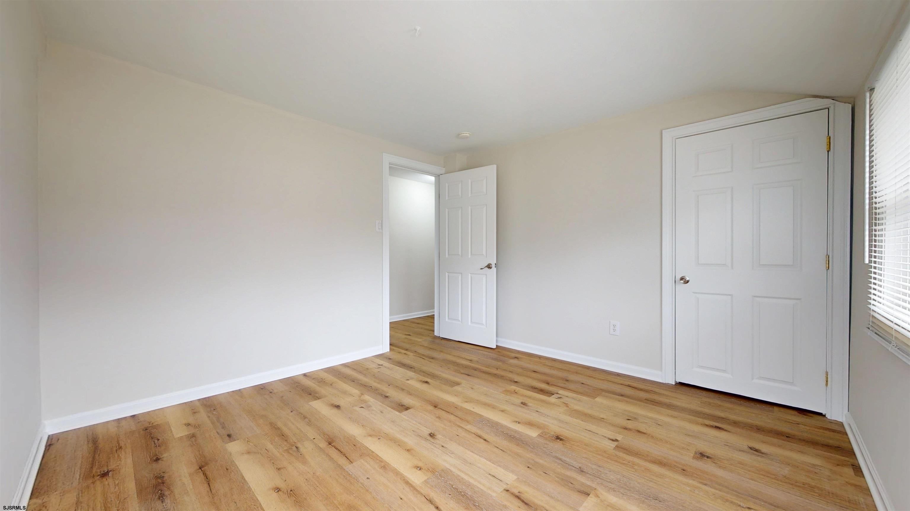 4 East Mill Road Northfield, NJ 08225 - Photo 32 of 49 a view of empty room with wooden floor
