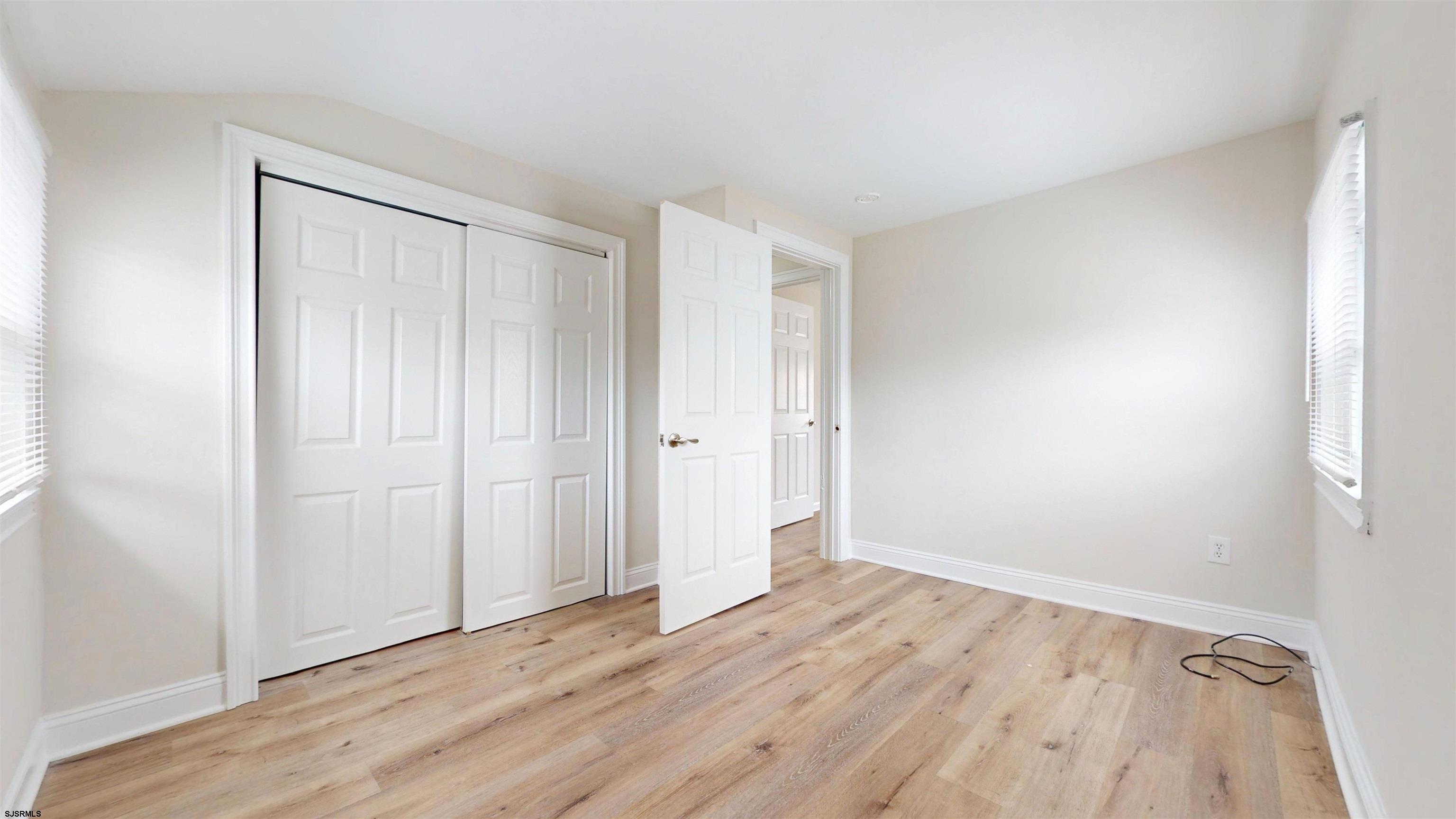 4 East Mill Road Northfield, NJ 08225 - Photo 34 of 49 a view of an empty room with wooden floor