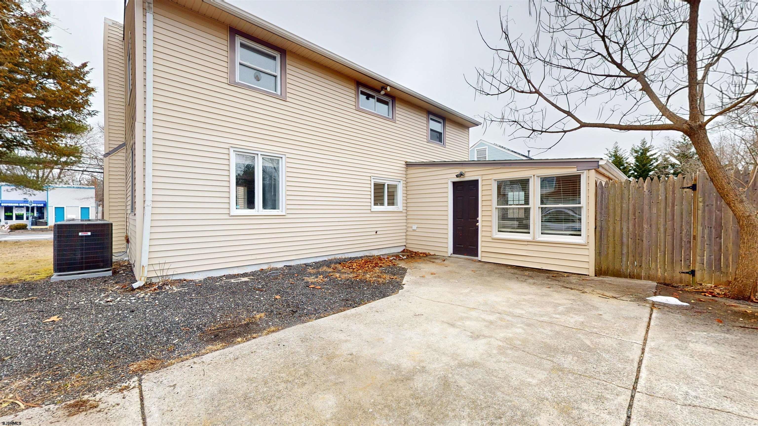 4 East Mill Road Northfield, NJ 08225 - Photo 41 of 49 a view of a house with a yard and garage