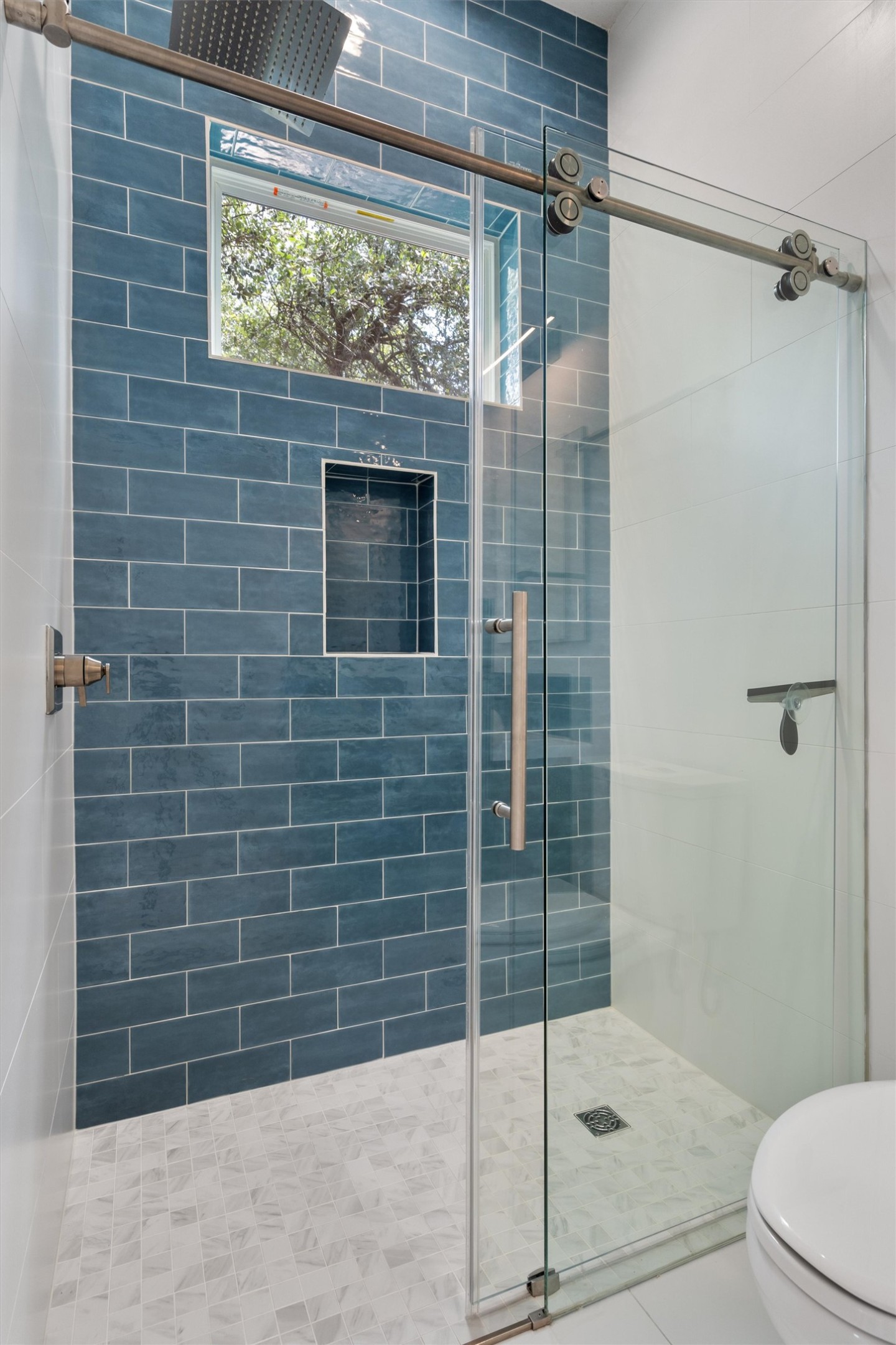 4712 Reyes Street, Unit 1 Austin, TX 78721 - Photo 19 of 38 a bathroom with a shower and toilet