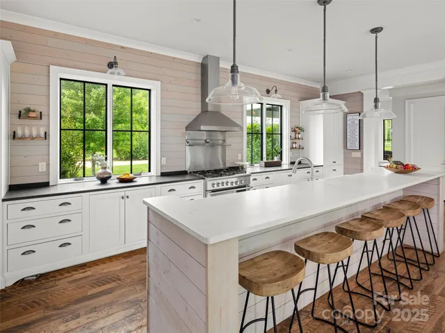 a spacious bedroom with a bed and a large window