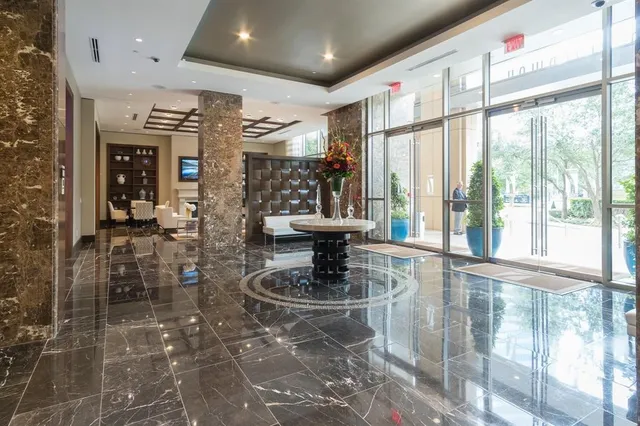 a view of a living room and a glass door
