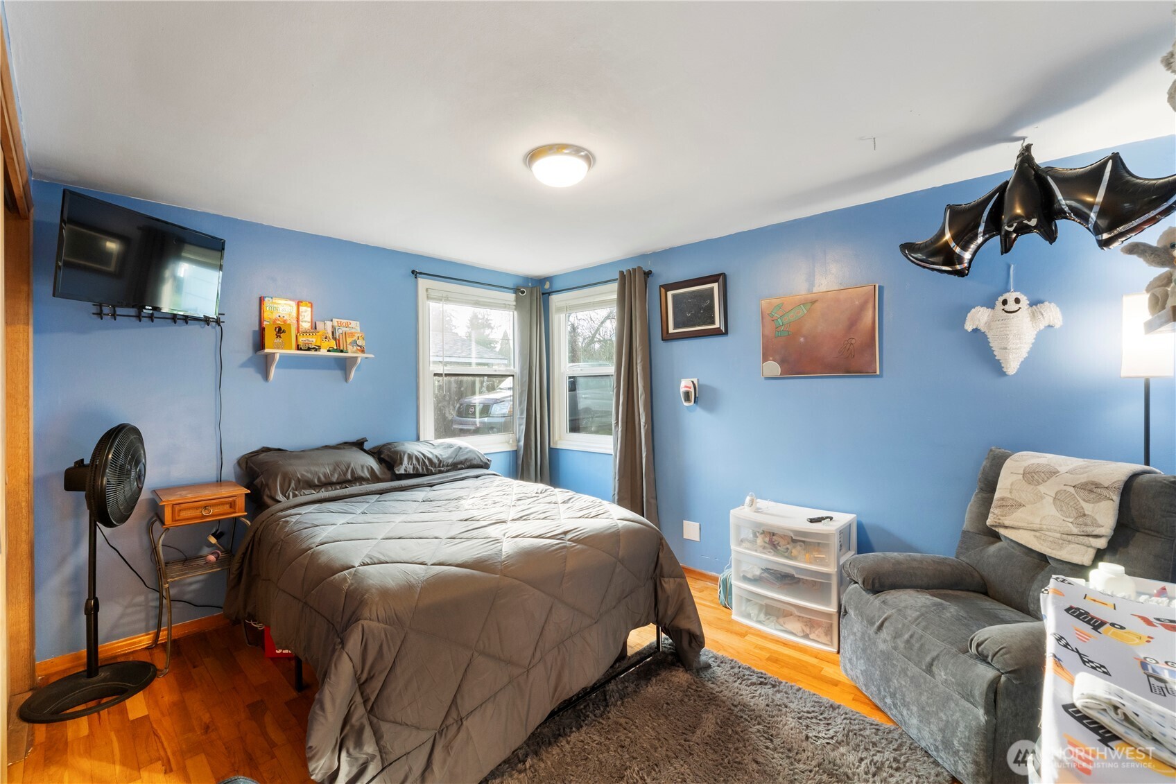 1411 Ruddell Road Southeast Lacey, WA 98503 - Photo 12 of 40 a bedroom with a bed and cabinets