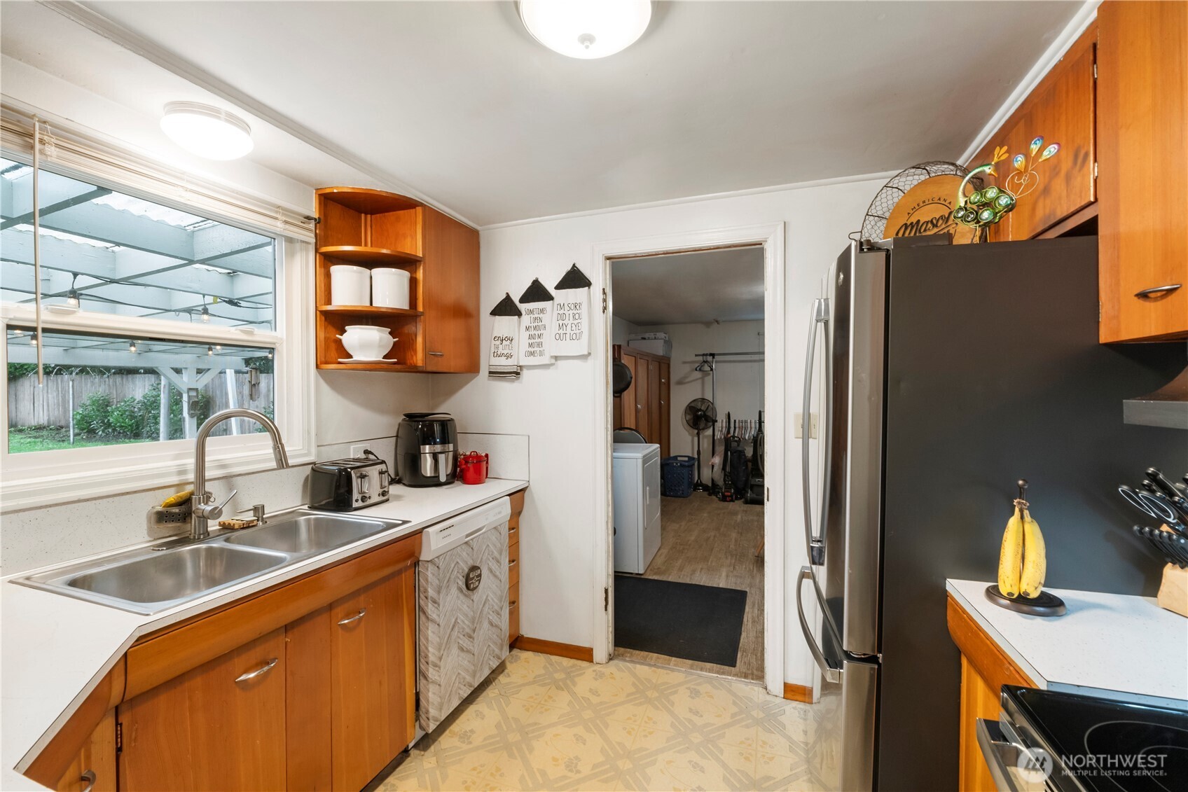 1411 Ruddell Road Southeast Lacey, WA 98503 - Photo 15 of 40 a kitchen with a sink stove and refrigerator