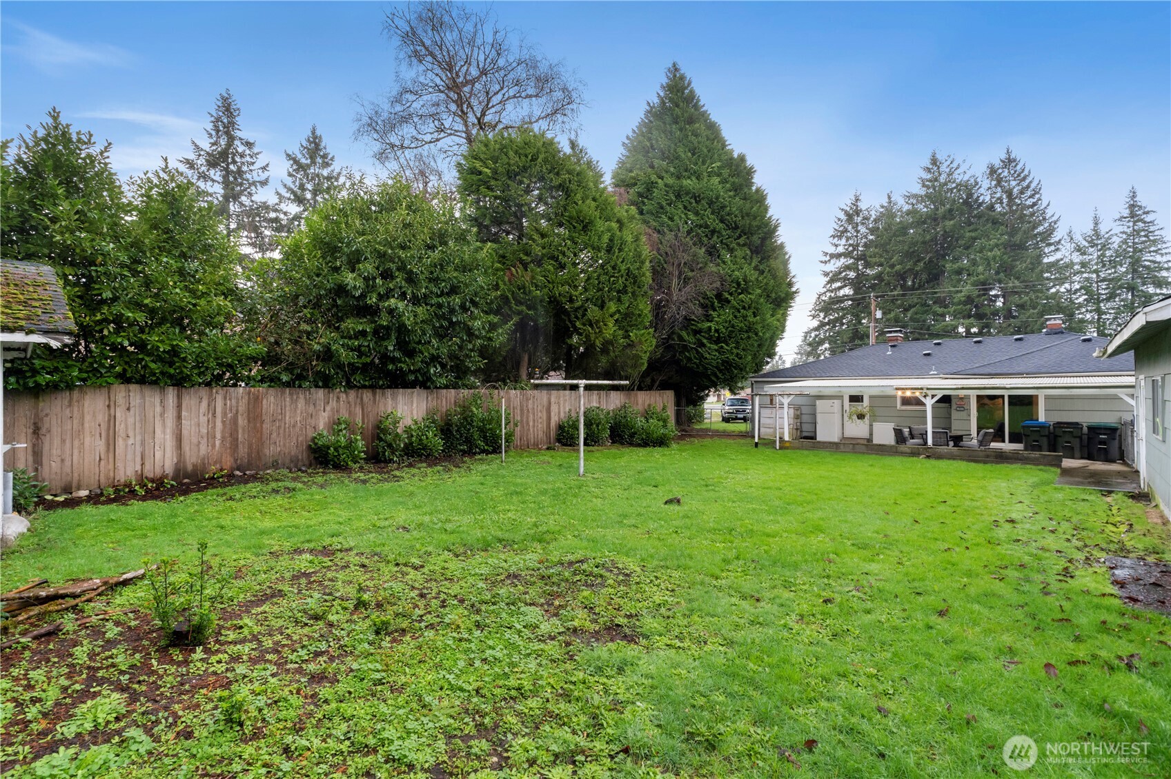 1411 Ruddell Road Southeast Lacey, WA 98503 - Photo 24 of 40 a view of a house with backyard and garden