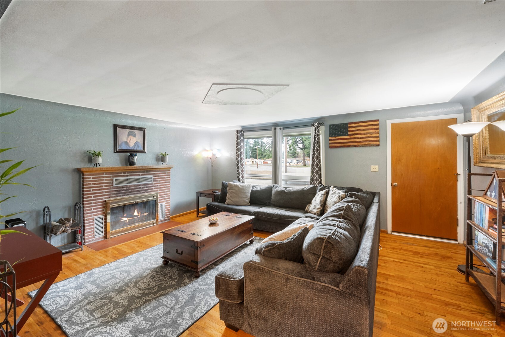 1411 Ruddell Road Southeast Lacey, WA 98503 - Photo 3 of 40 a living room with furniture and a fireplace