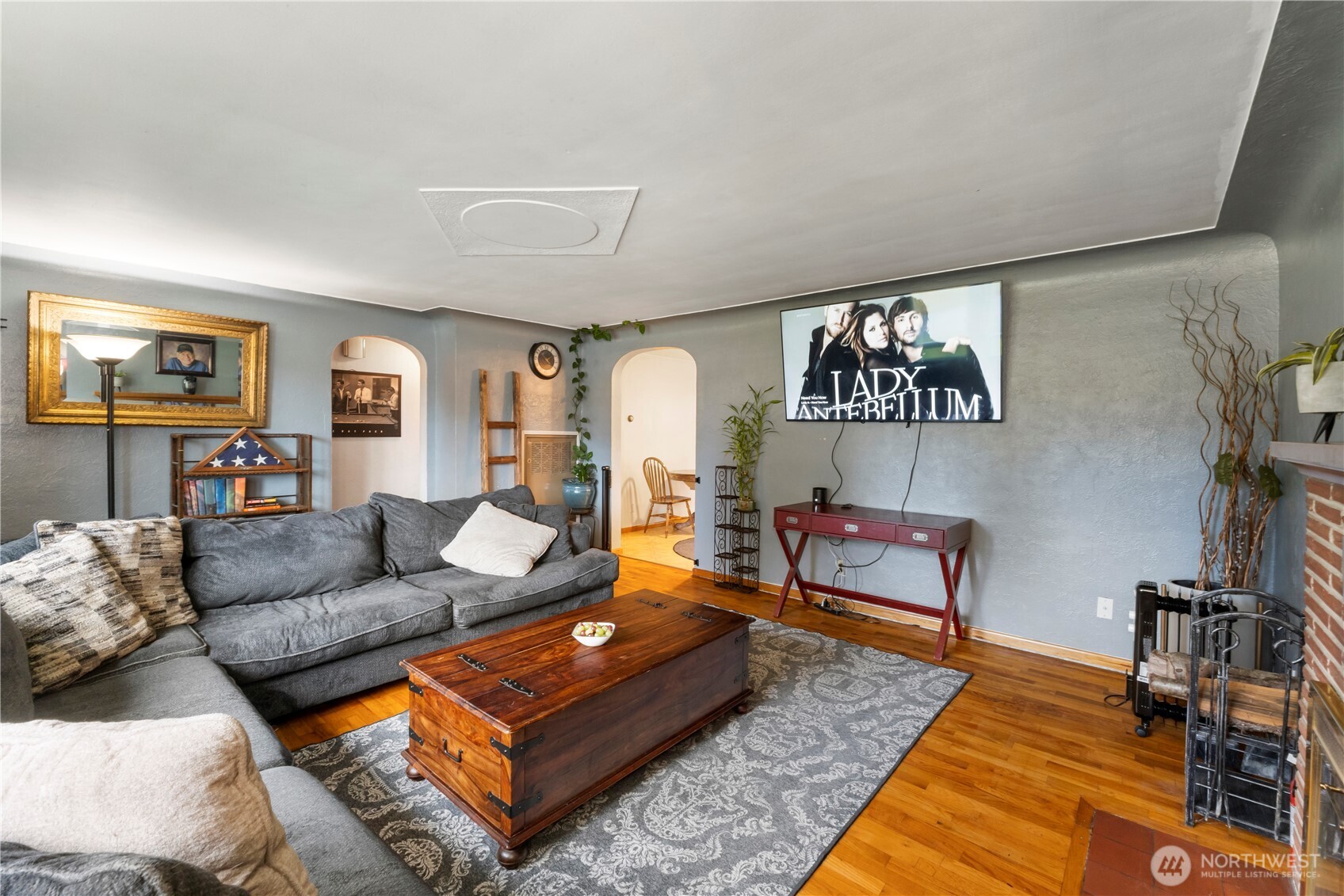 1411 Ruddell Road Southeast Lacey, WA 98503 - Photo 4 of 40 a living room with furniture and wooden floor