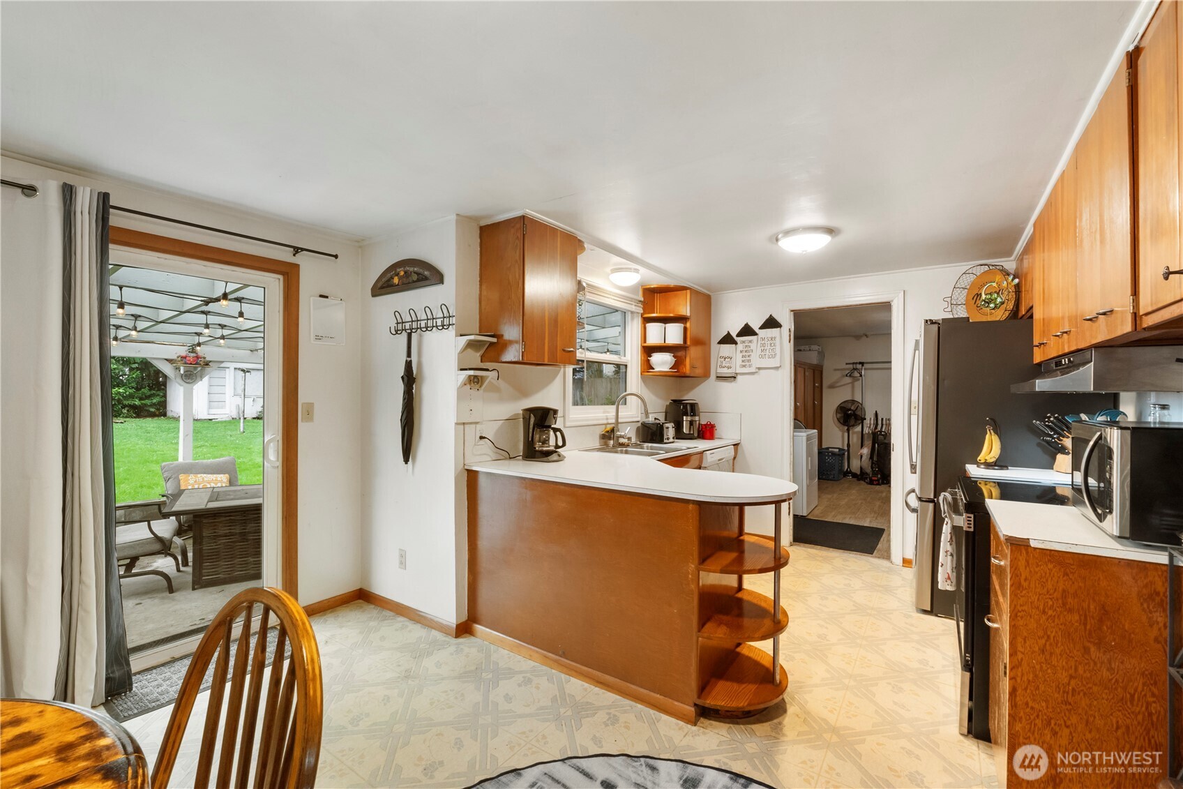 1411 Ruddell Road Southeast Lacey, WA 98503 - Photo 5 of 40 a kitchen with stainless steel appliances kitchen island granite countertop a refrigerator and a stove