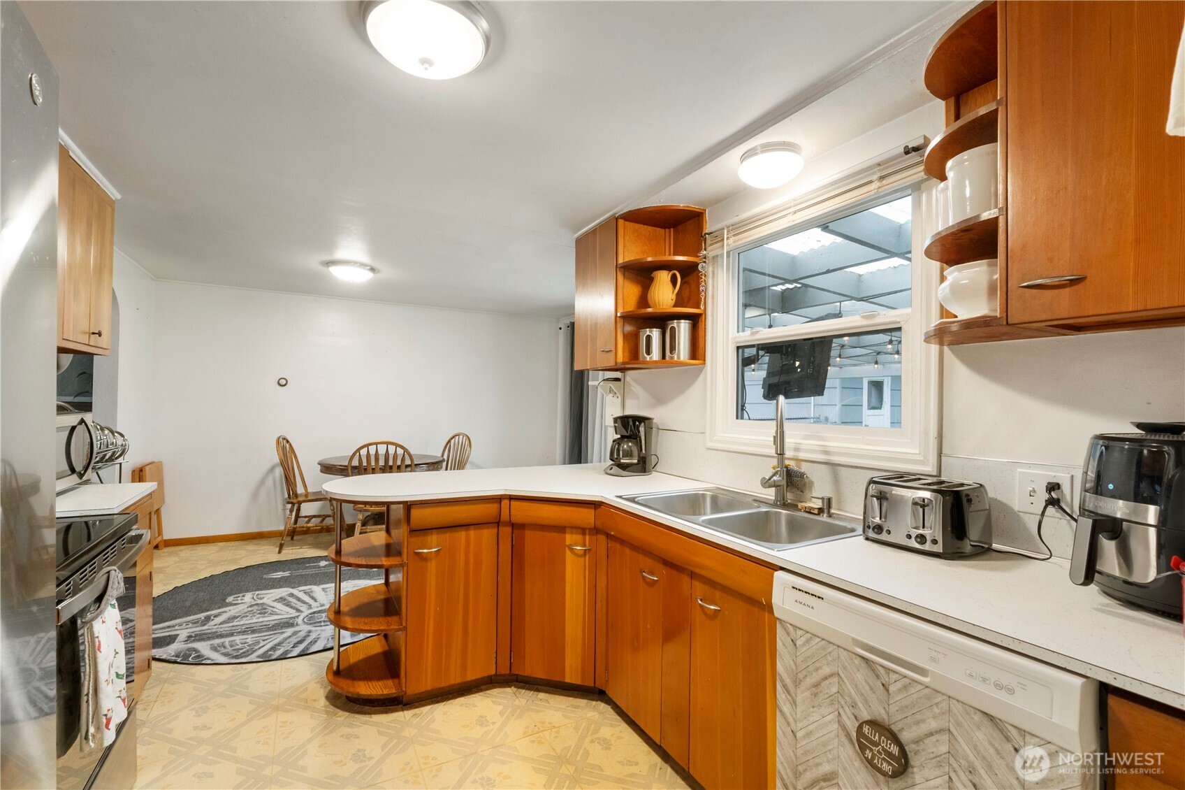 1411 Ruddell Road Southeast Lacey, WA 98503 - Photo 6 of 40 a kitchen with a sink and a stove top oven