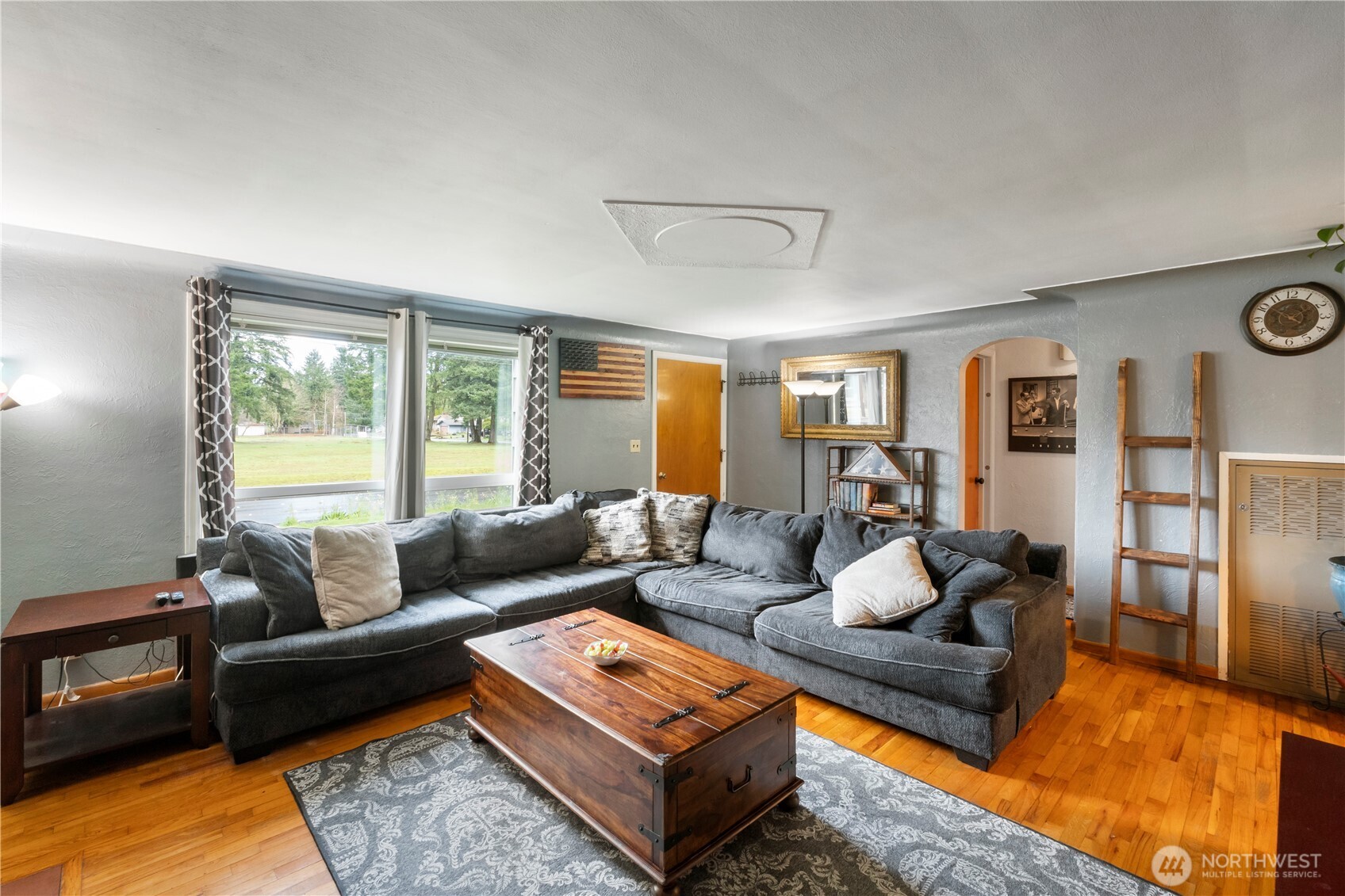 1411 Ruddell Road Southeast Lacey, WA 98503 - Photo 7 of 40 a living room with furniture and wooden floor